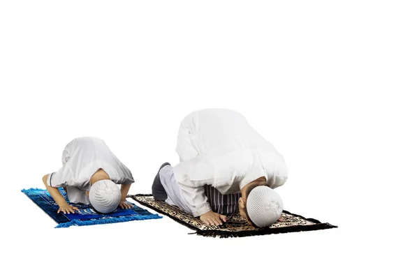 Devout family is prostration on studio — Stock Photo, Image