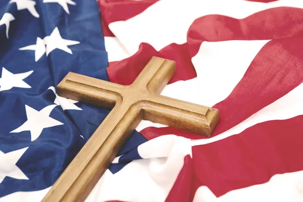 American flag with a wooden crucifix — Stock Photo, Image