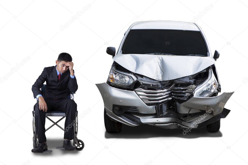 Disabled man and damaged car