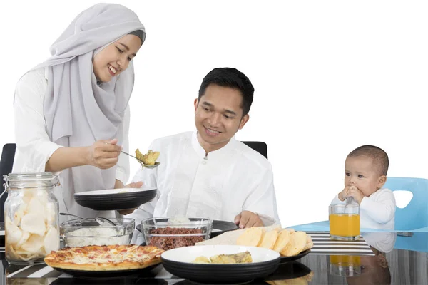 Muslim family eating at dining table — Stock Photo, Image