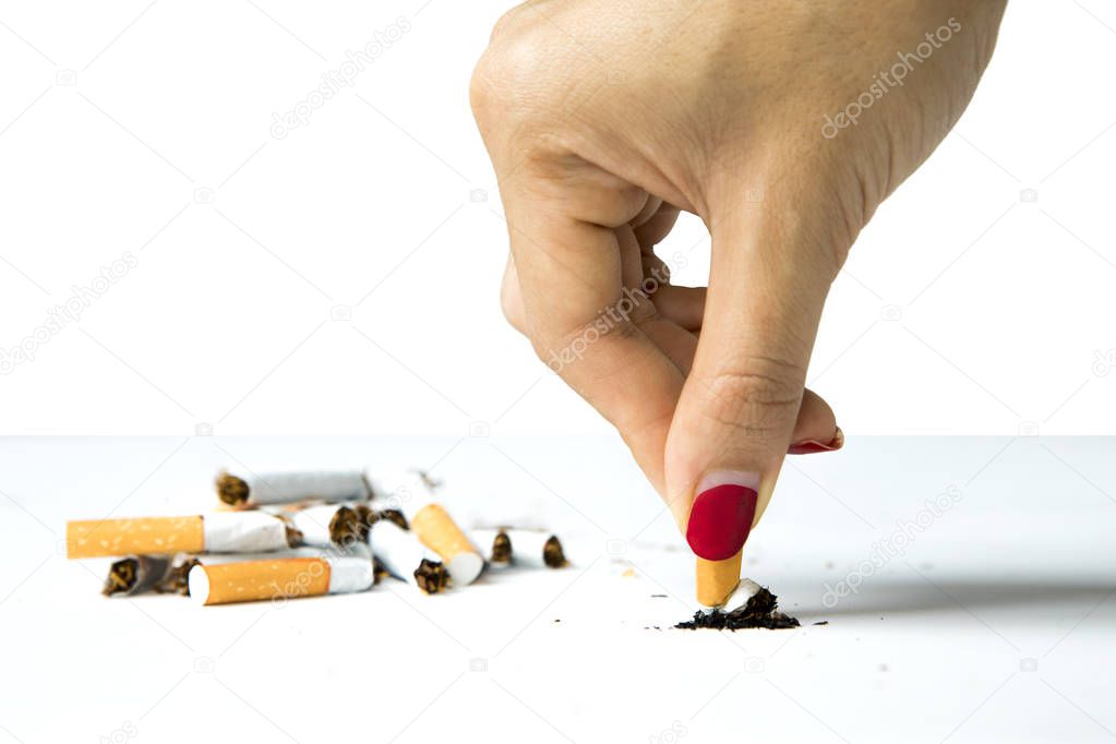 Woman destroying cigarette in hand 