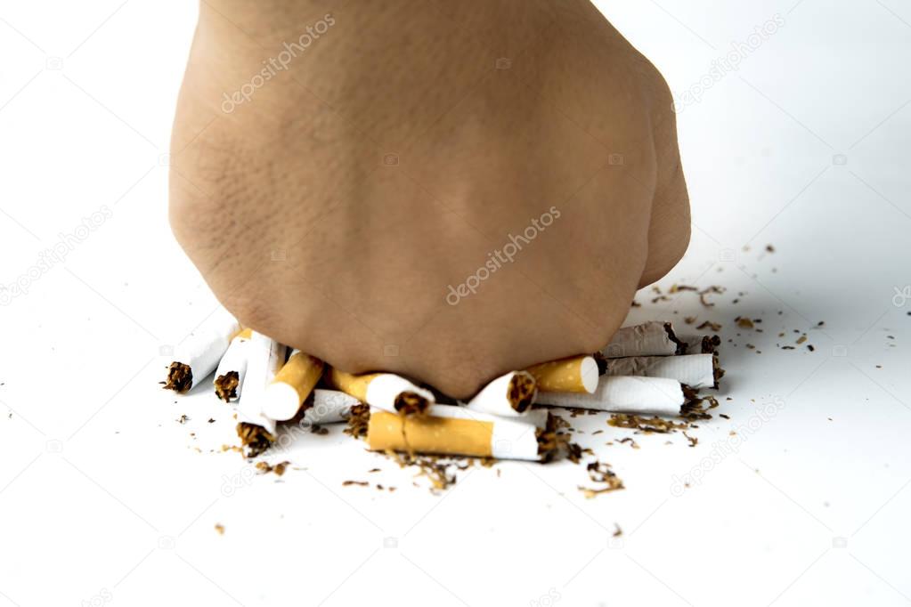 Female hand destroying cigarette 