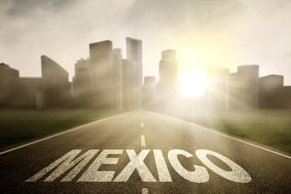 Mexico word on empty road at sunrise — Stock Photo, Image