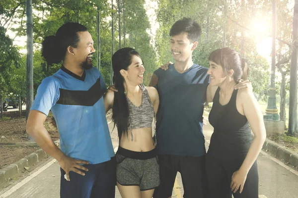 Group of friends standing in park — Stock Photo, Image