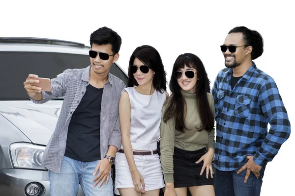 Young friends taking selfie picture with car — Stock Photo, Image