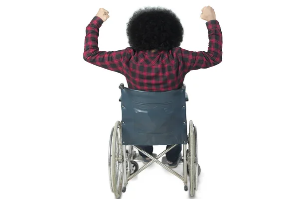 Hombre discapacitado levantando las manos en el estudio —  Fotos de Stock