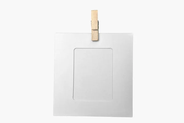 Blank frame with wooden clothespin — Stock Photo, Image