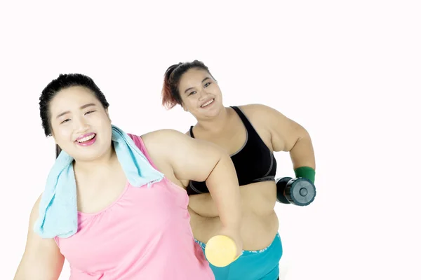 Obese women doing workout with dumbbell — Stock Photo, Image