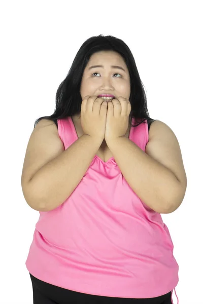 Overweight woman biting her fingernails — Stock Photo, Image