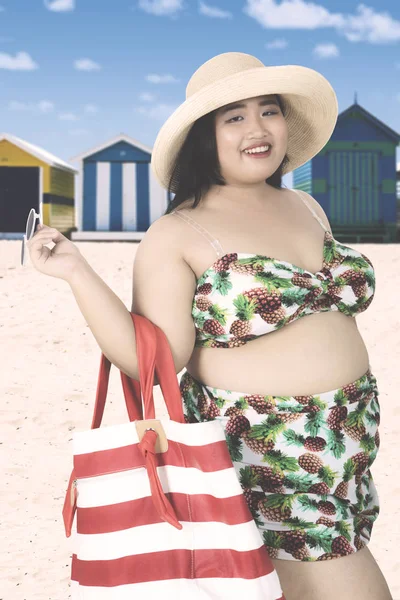 Obese woman with swimsuit at coast — Stock Photo, Image