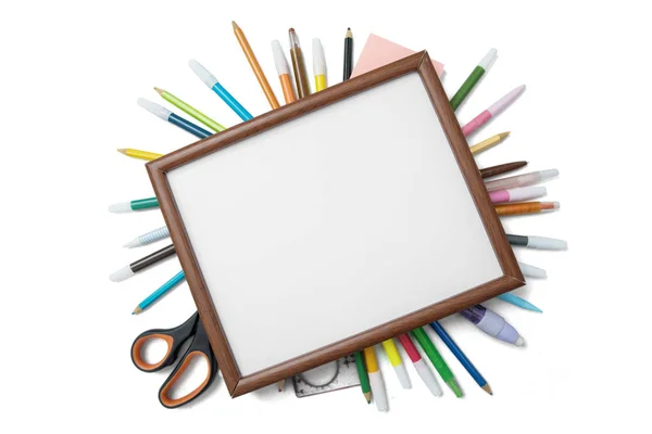 Blank frame over school supplies — Stock Photo, Image