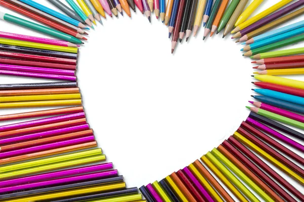 Color pencils shaped heart symbol — Stock Photo, Image