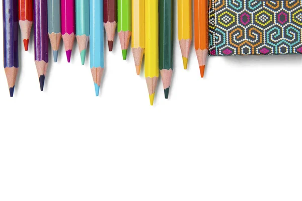 Multicolored pencils and book on white background — Stock Photo, Image