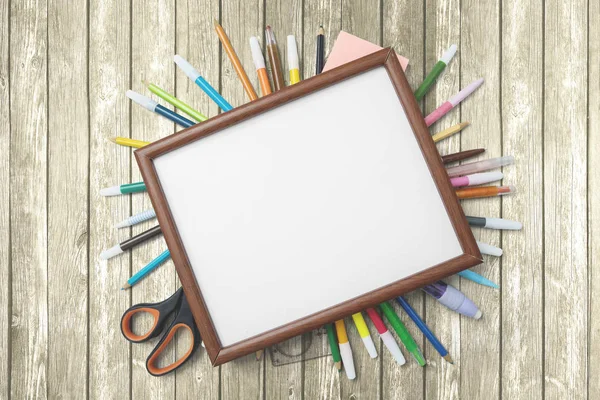 School supplies with empty frame on the table — Stock Photo, Image