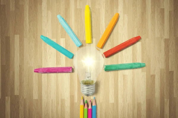 Bulb and colorful crayons — Stock Photo, Image