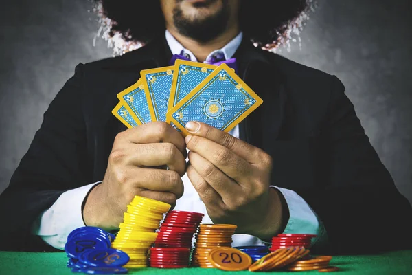 Gambler playing cards and bet with chip — Stock Photo, Image