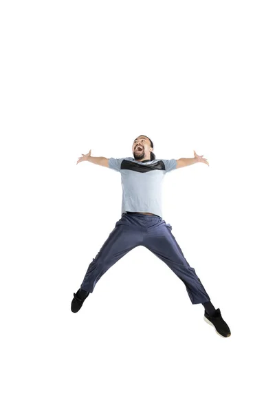 African man with sportswear jumps in studio — Stock Photo, Image