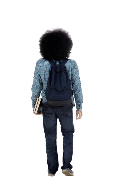 Afro student with books on studio — Stock Photo, Image