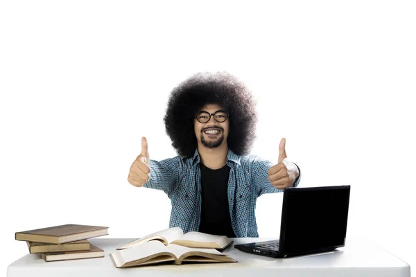 Afro student with thumbs up on studio — Stock Photo, Image