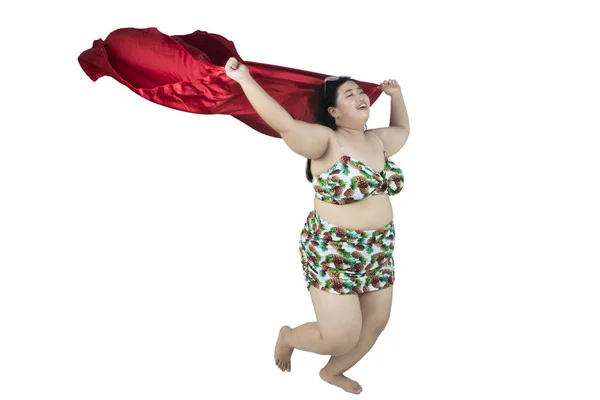 Nadwagę kobieta trzymając tkaninę na studio — Zdjęcie stockowe