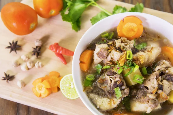 Indonesian oxtail soup on table — Stock Image Indonesian oxtail soup on table Stock Image