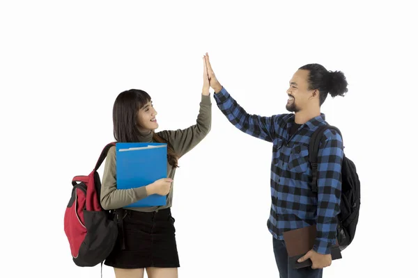 Two college students giving high five together — Stock Photo, Image