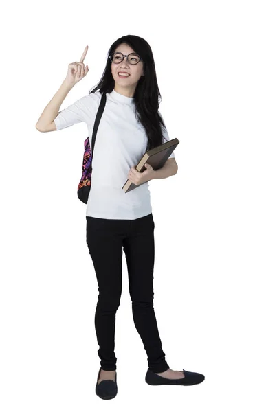 Asian student pointing up — Stock Photo, Image
