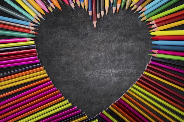 Colorful pencils makes heart shape — Stock Photo, Image