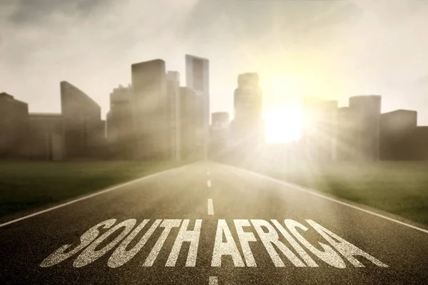 Jižní Afrika slovo na prázdné silnici — Stock fotografie