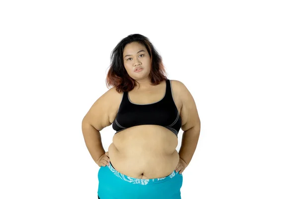 Självsäker fet kvinna bära sportkläder — Stockfoto