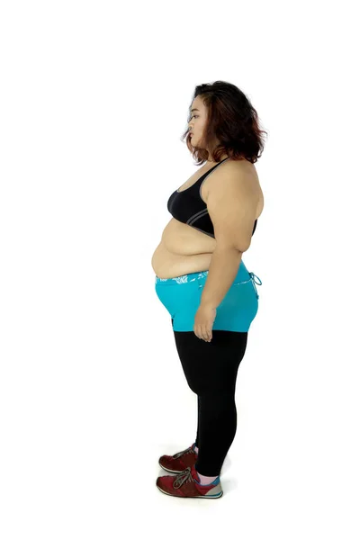 Overweight woman standing in the studio — Stock Photo, Image