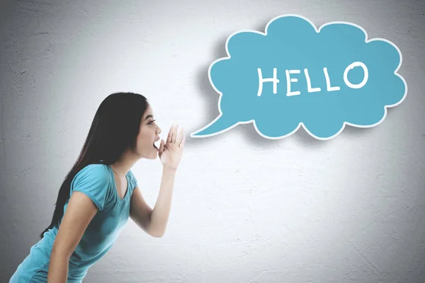 Asian woman whispering word of hello — Stock Photo, Image