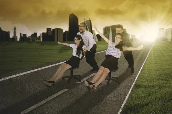 Business people racing on the road — Stock Photo, Image