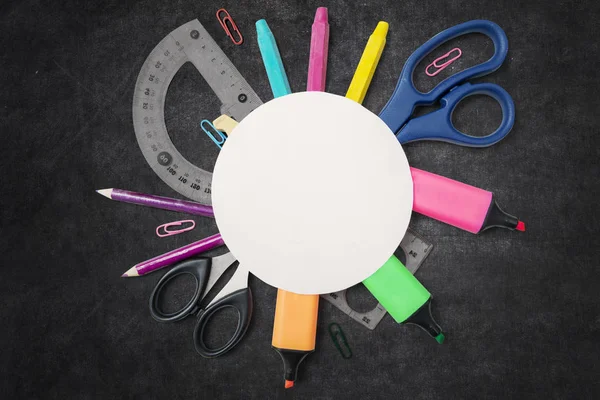 Empty round paper over school supplies — Stock Photo, Image