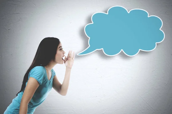 Young woman whispering to an empty cloud — Stock Photo, Image