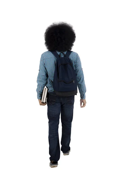 Afro student carrying books and bag — Stock Photo, Image