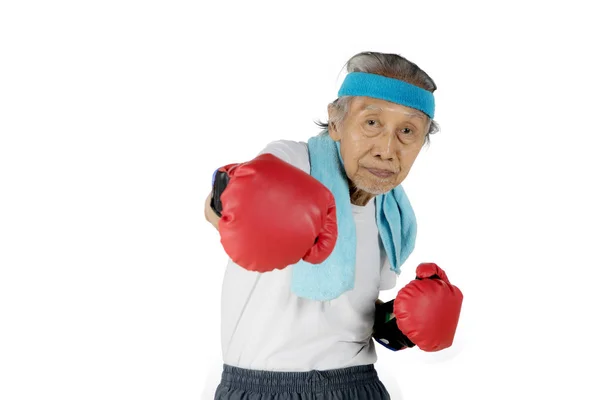 Old man punching at the camera — Stock Photo, Image