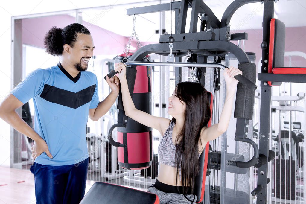 Woman with her friend in the fitness center