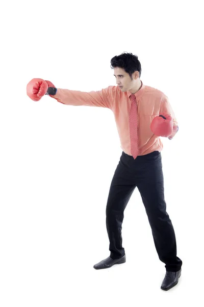 Young businessman punching something on studio — Stock Photo, Image