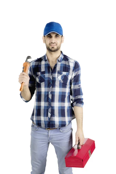 Loodgieter man die een moersleutel op studio — Stockfoto
