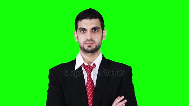 Handsome businessman folded hands in studio — Stock Video