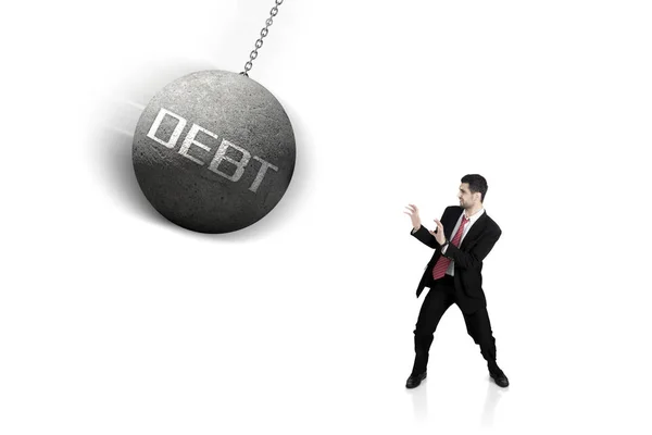 Italian businessman with debt word on studio — Stock Photo, Image