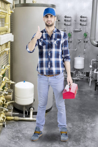 Italian plumber showing thumb up at the camera