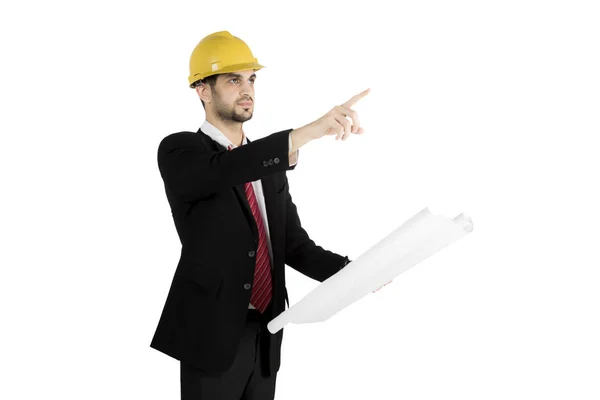 Engineer with blueprints pointing at copyspace — Stock Photo, Image