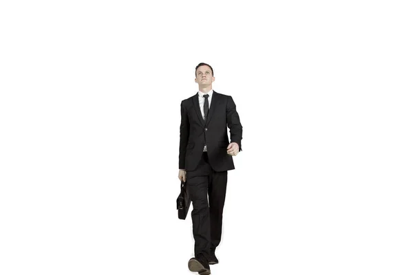 Uomo d'affari con valigia cammina in studio — Foto Stock