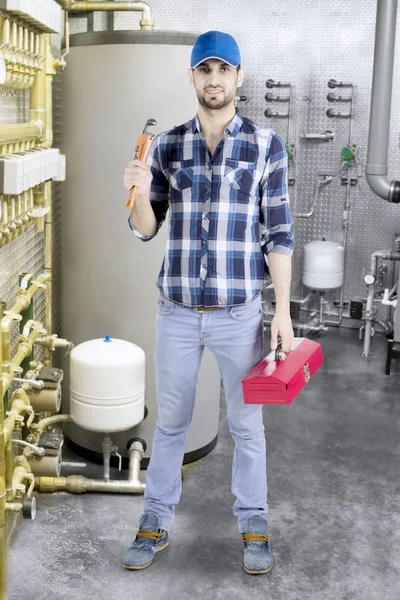 Arabian plumber with wrench in the basement — Stock Photo, Image