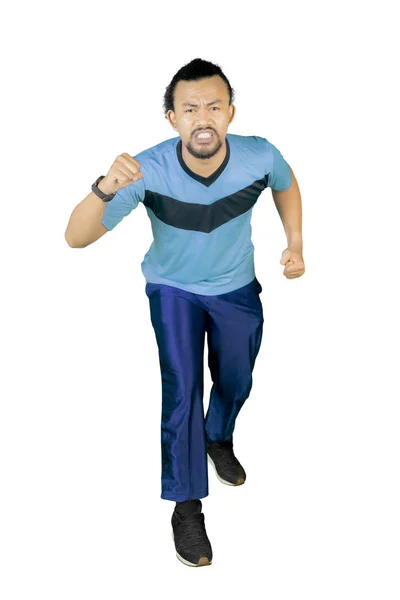 Afro homem fazendo um exercício de corrida no estúdio — Fotografia de Stock