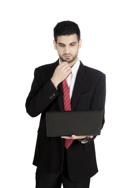 Pensivo empresário italiano com um laptop — Fotografia de Stock