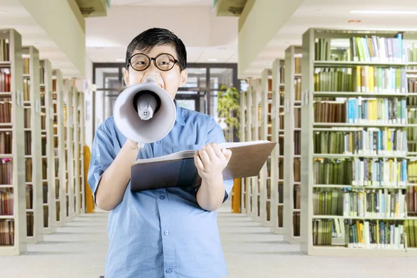 Schoolboy shouting on megaphone — Stock Photo, Image