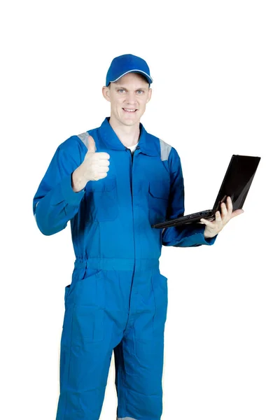 Evropská mechanik s palcem nahoru a laptop — Stock fotografie